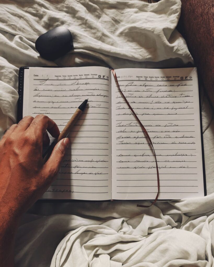 person writing in diary